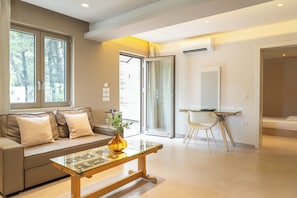 Deluxe Family Suite With Sea View | Living area | Flat-screen TV, printers - Core Luxury Suites (Skiathos)