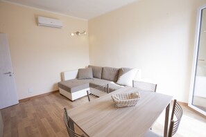 Apartment, 2 Bedrooms | Living area | Flat-screen TV