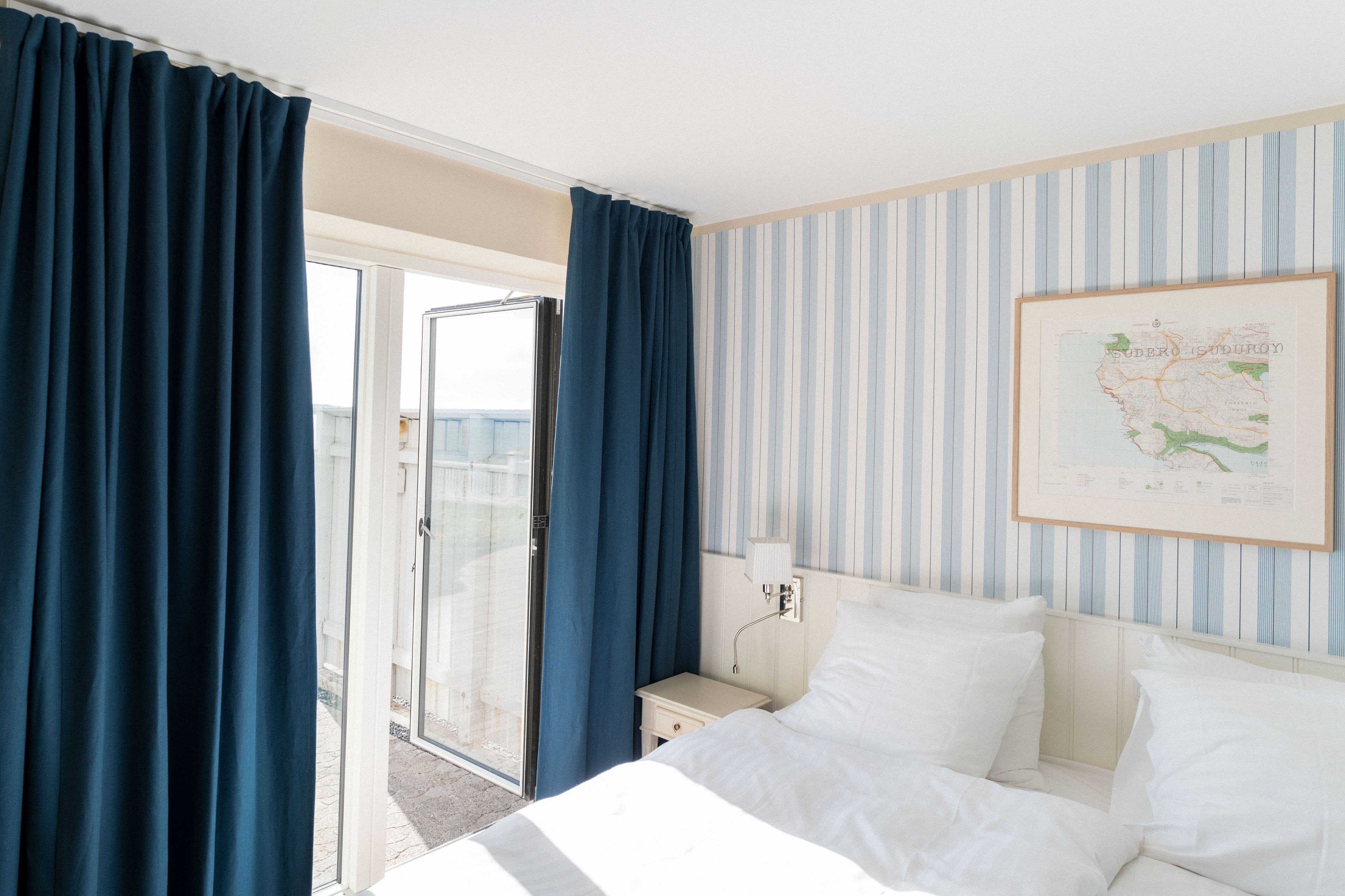 deluxe double room, 1 king bed, ocean view | minibar, in-room safe, individually decorated, desk