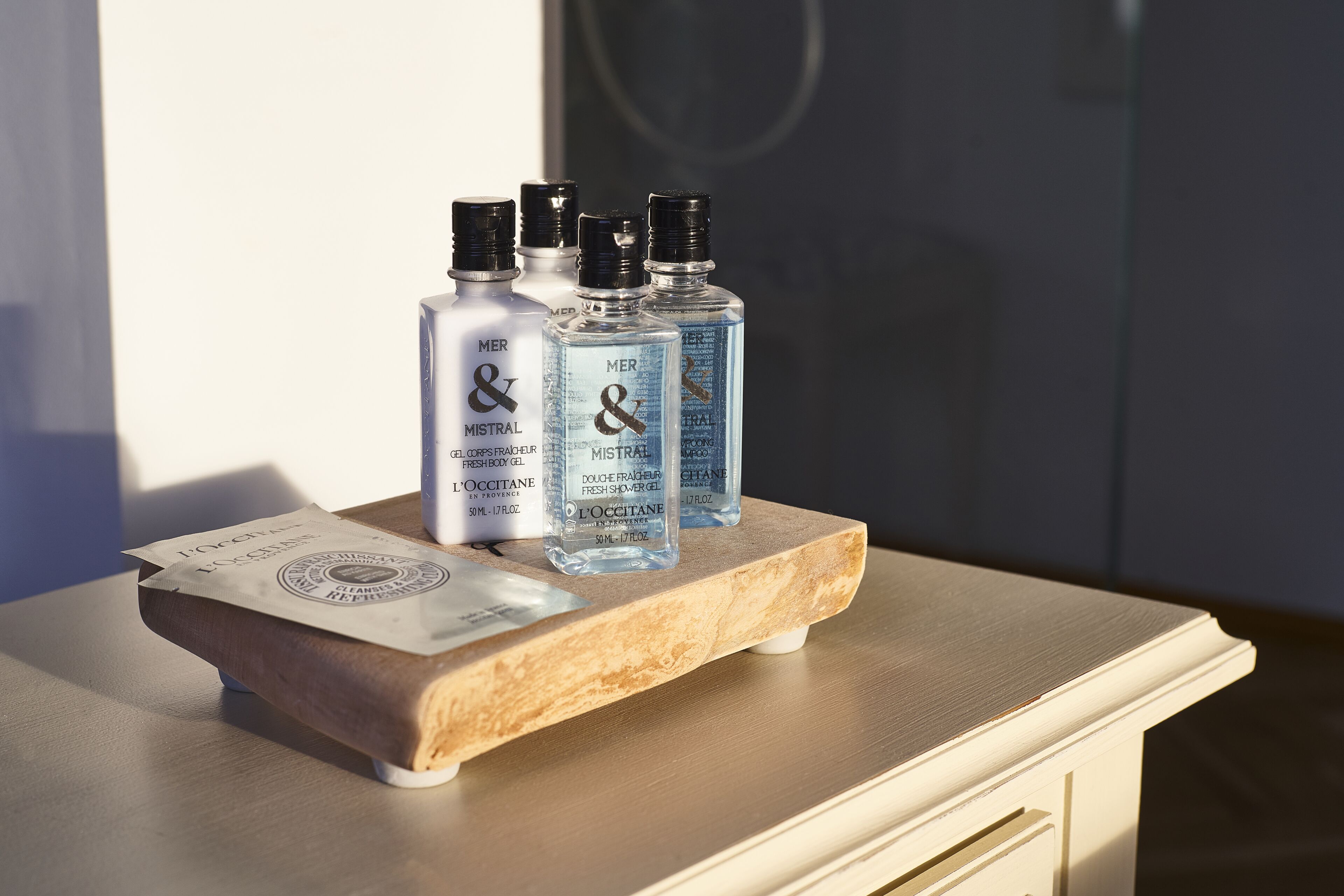 shower, designer toiletries, hair dryer, slippers