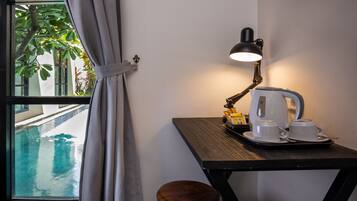 Deluxe Double Room, Pool View | In-room safe, desk, free WiFi, bed sheets