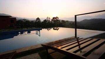 Outdoor pool, open 8 AM to 8 PM, pool umbrellas, pool loungers