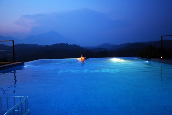Outdoor pool, open 8 AM to 8 PM, pool umbrellas, sun loungers - Petals Resorts Wayanad (Vythiri)