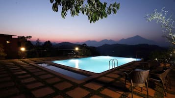 Outdoor pool, open 8 AM to 8 PM, pool umbrellas, pool loungers