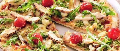 A pizza with various toppings.