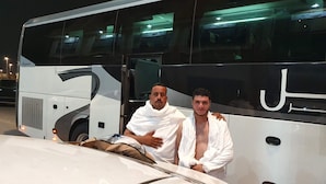 A bus with a large logo and a car parked in front. - Sidra Alia AL-DAHABI hotel - فندق السدرة العالية الذهبي (Madinah)
