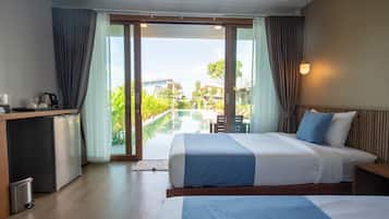 Deluxe Twin Room, Poolside | Minibar, blackout curtains, free cots/infant beds, rollaway beds