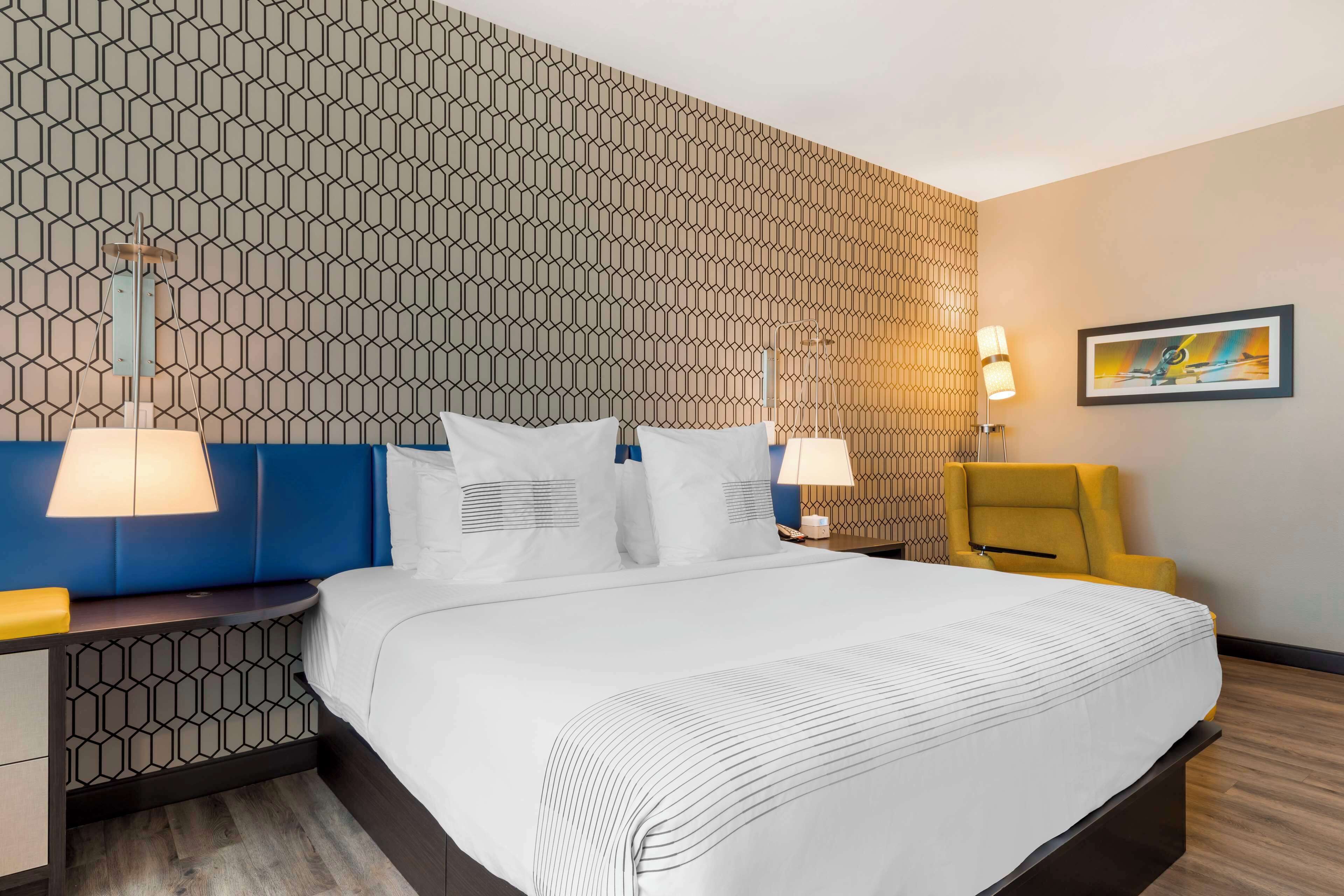 premium bedding, pillow-top beds, blackout curtains, iron/ironing board