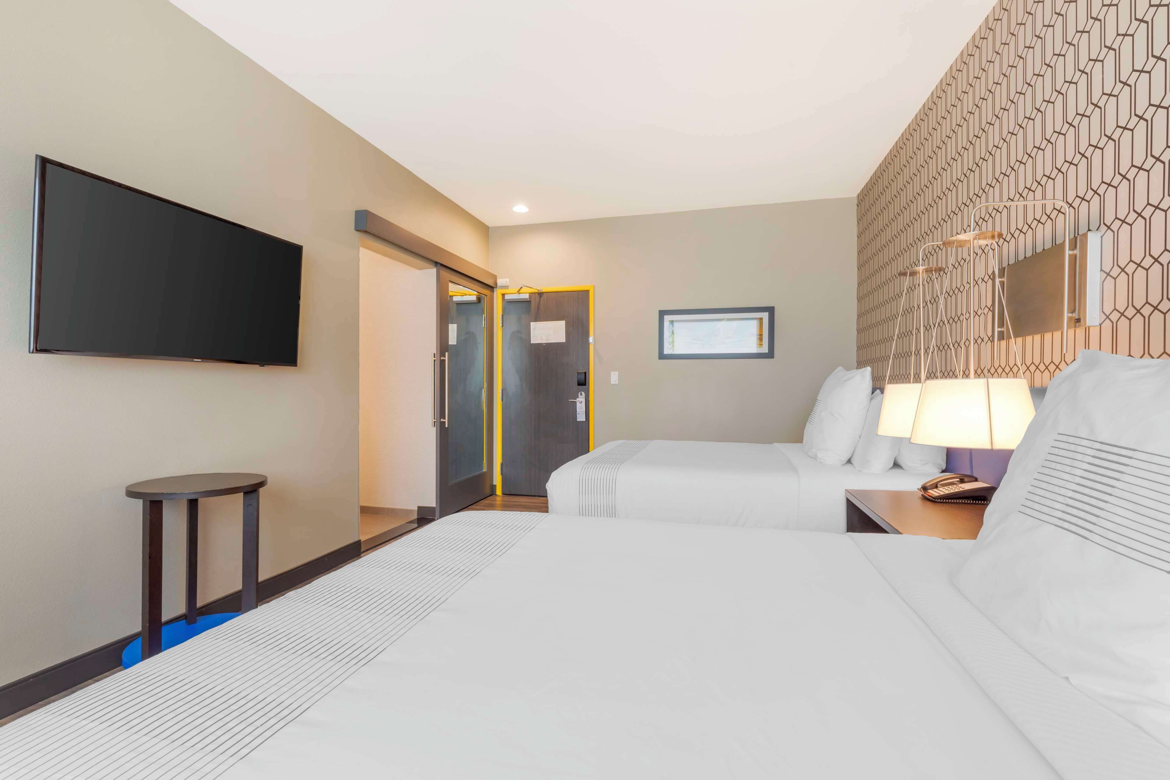 premium bedding, pillow-top beds, blackout curtains, iron/ironing board