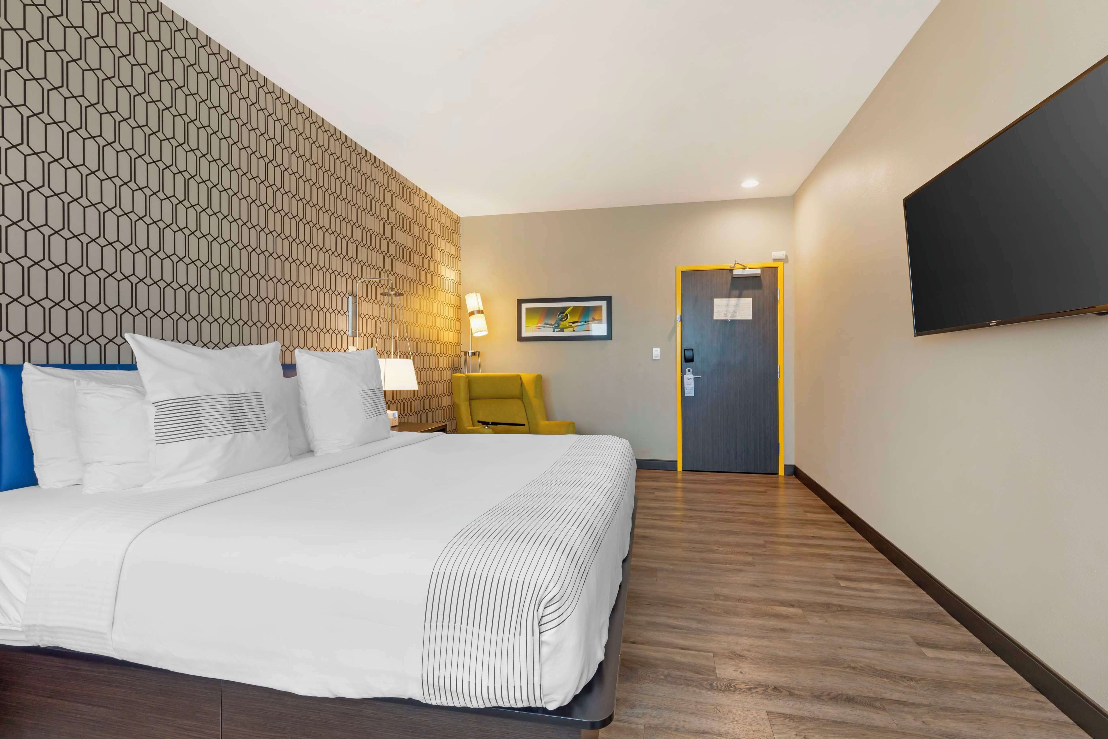 premium bedding, pillow-top beds, blackout curtains, iron/ironing board