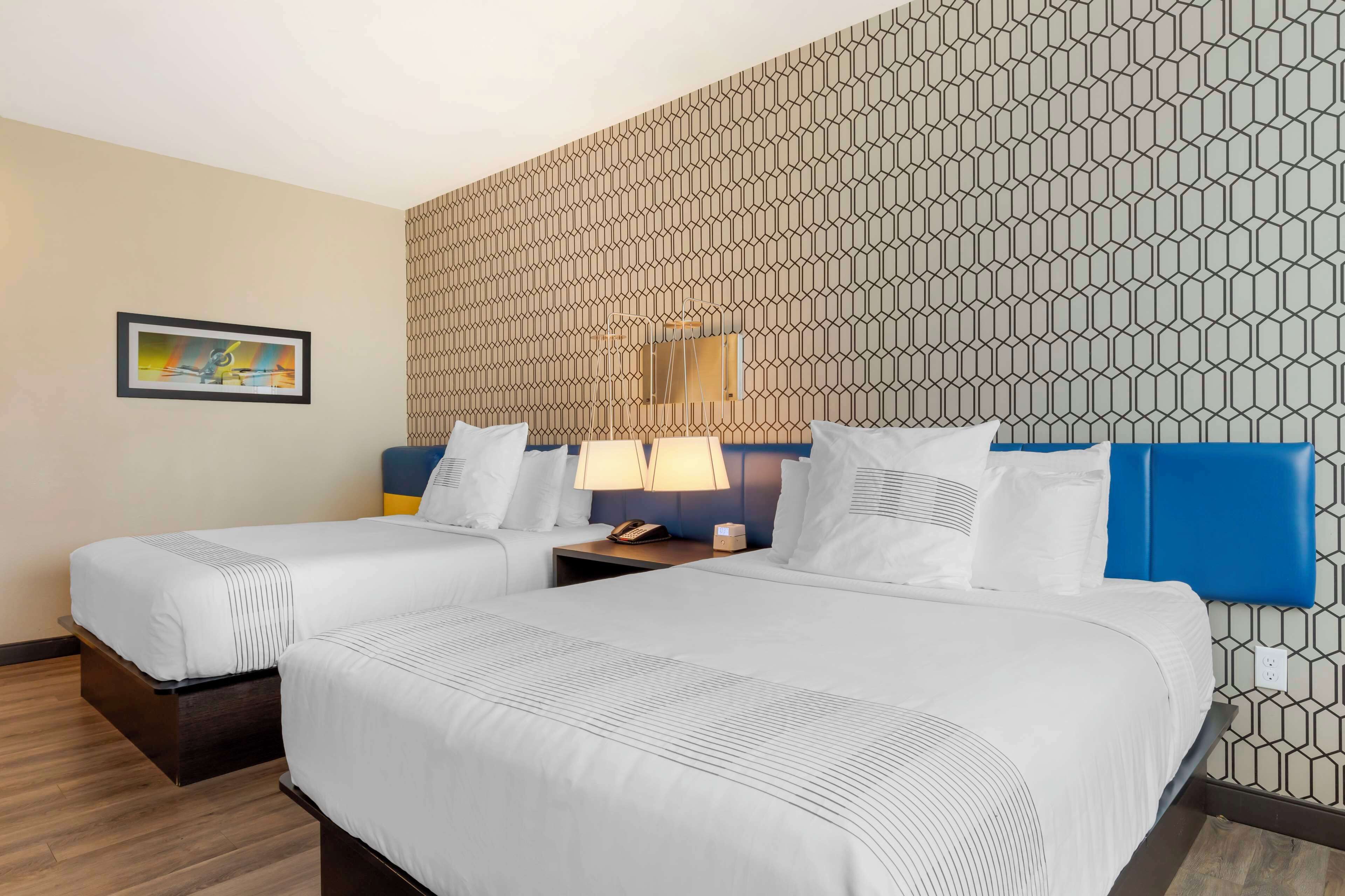 premium bedding, pillow-top beds, blackout curtains, iron/ironing board