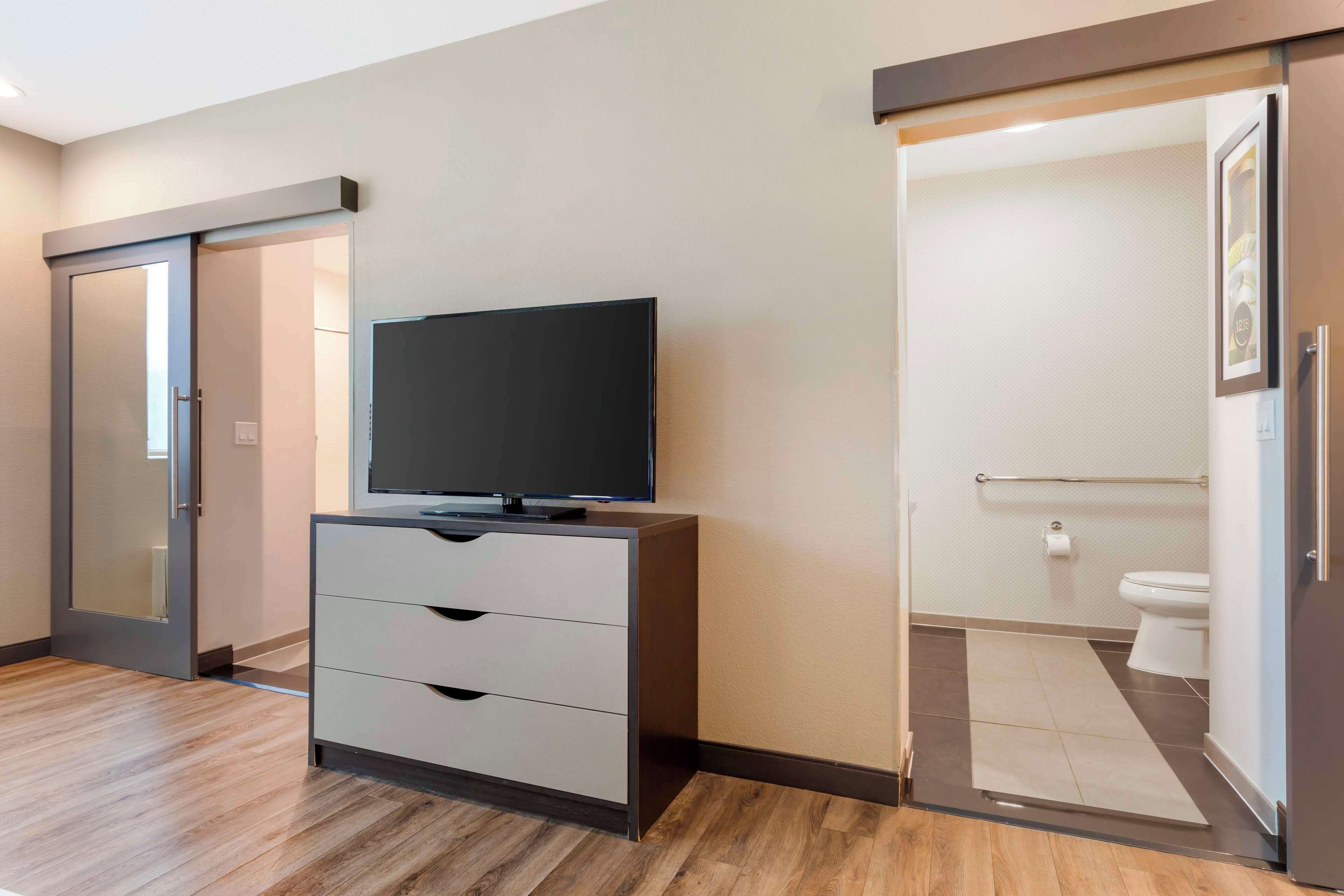 premium bedding, pillow-top beds, blackout curtains, iron/ironing board