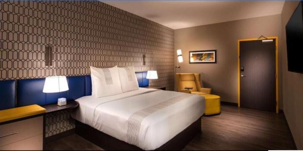 Premium bedding, pillow-top beds, blackout curtains, iron/ironing board