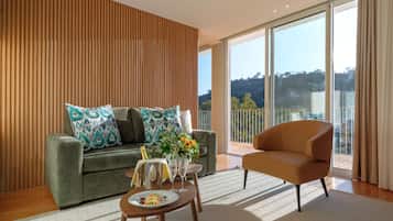 Charming Suite | Living area | Flat-screen TV