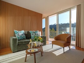 Charming Suite | Living area | Flat-screen TV