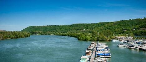A river with a dock and boats.