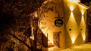 A building with a sign reading "Casa Mono" and a staircase leading to the entrance. - Casa Mono (Santa María Tonameca)