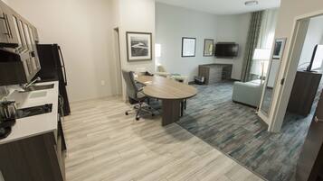 Premium bedding, desk, laptop workspace, iron/ironing board