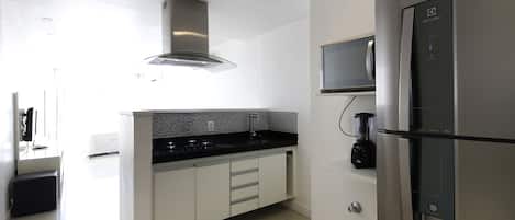 Apartment | Private kitchenette | Full-size fridge, microwave, stovetop, coffee/tea maker