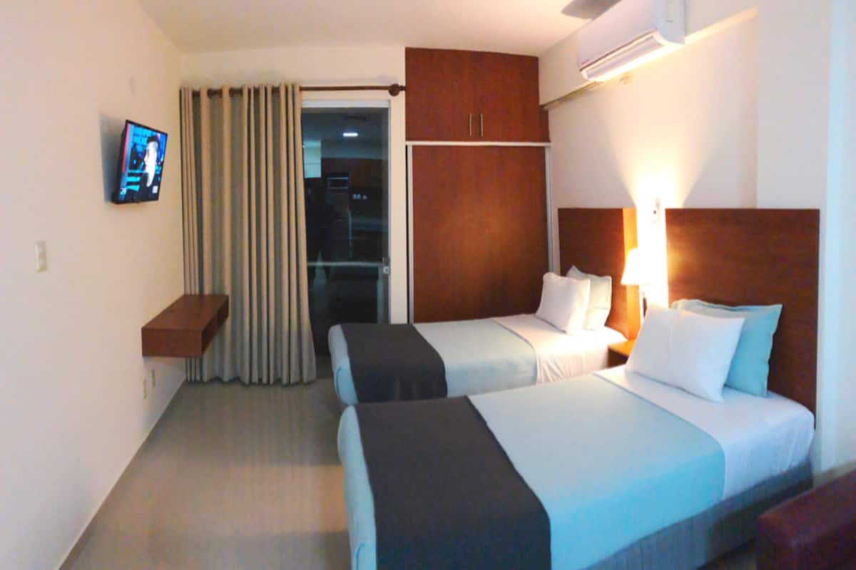 Appartement, 2 lits une place | Vue de la chambre