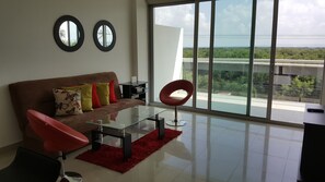 Apartment, 2 Doppelbetten, Meerblick | Wohnbereich