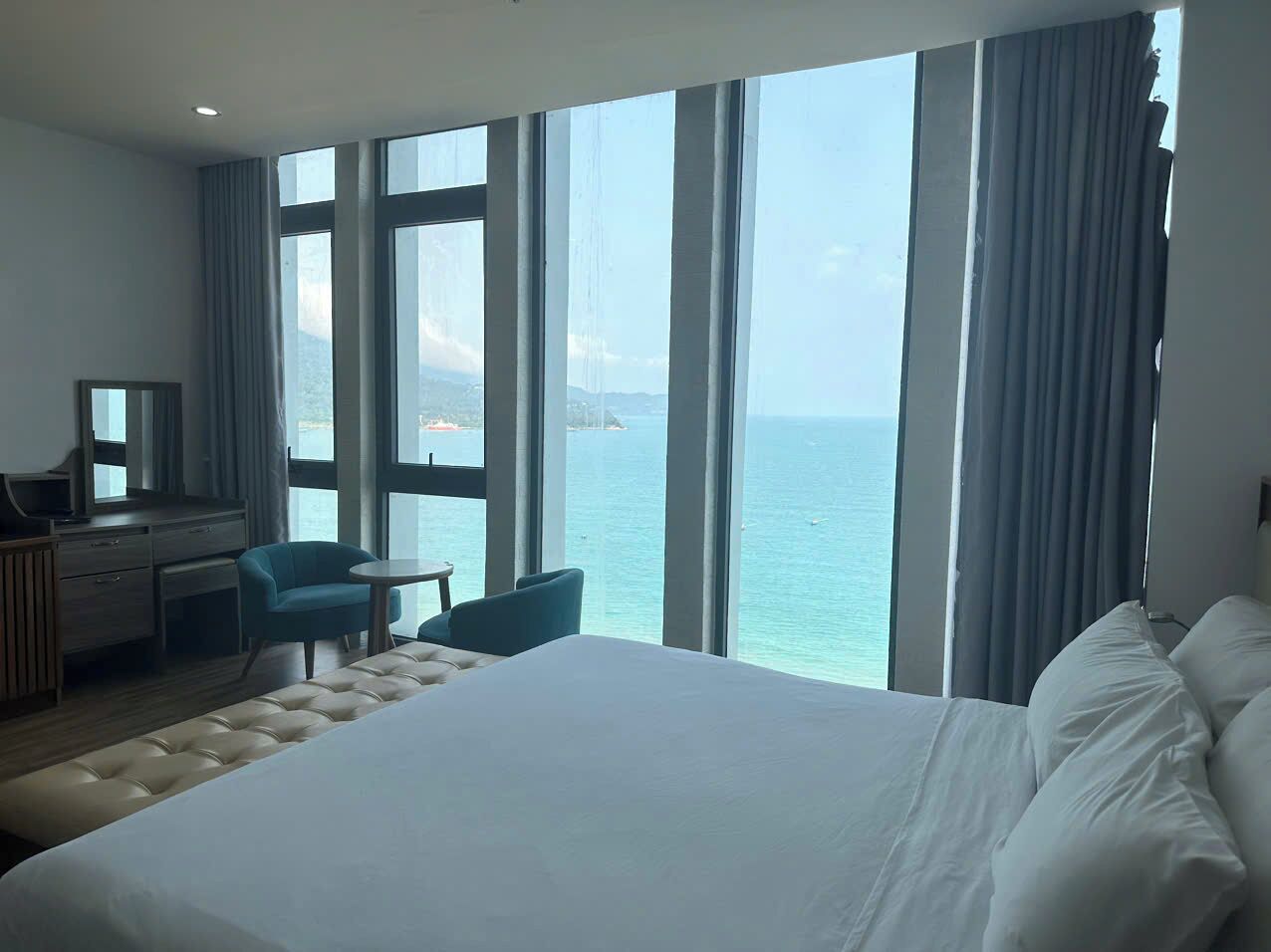 deluxe double room, ocean view | premium bedding, in-room safe, desk, laptop workspace