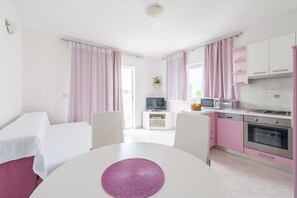 Apartment, 1 Bedroom, Sea View | Living area | Flat-screen TV - Apartmani Nikolina (Hvar)