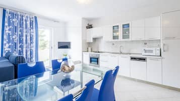 Apartment, 1 Bedroom, Sea View (Plavi) | Private kitchen | Fridge, microwave, oven, stovetop