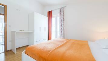 Apartment, 1 Bedroom, Sea View | 1 bedroom, desk, blackout drapes, soundproofing