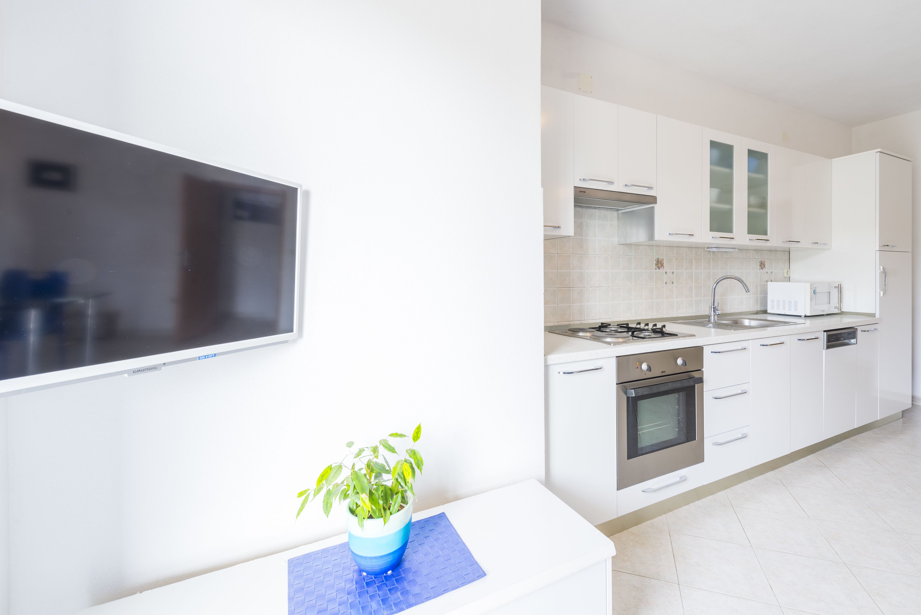 Apartment, 1 Bedroom, Sea View (Plavi) | Living area | Flat-screen TV