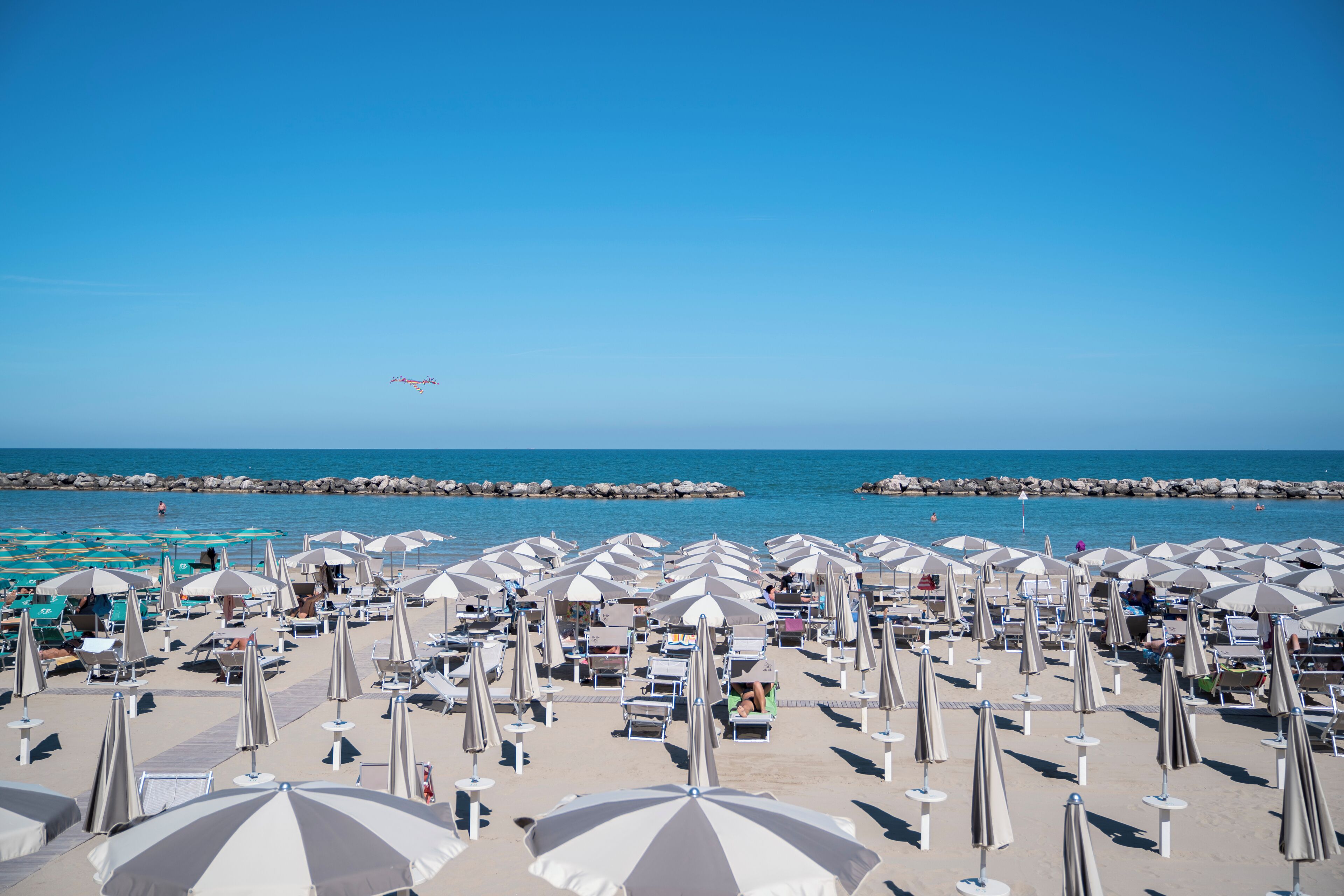On the beach, sun loungers, beach umbrellas, 2 beach bars