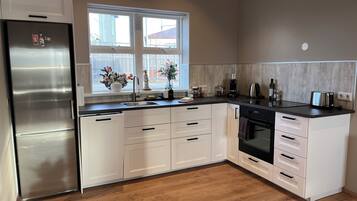 Apartment, 2 Bedrooms | Private kitchen | Fridge, microwave, oven, stovetop