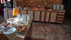 A breakfast buffet with various food items and beverages.