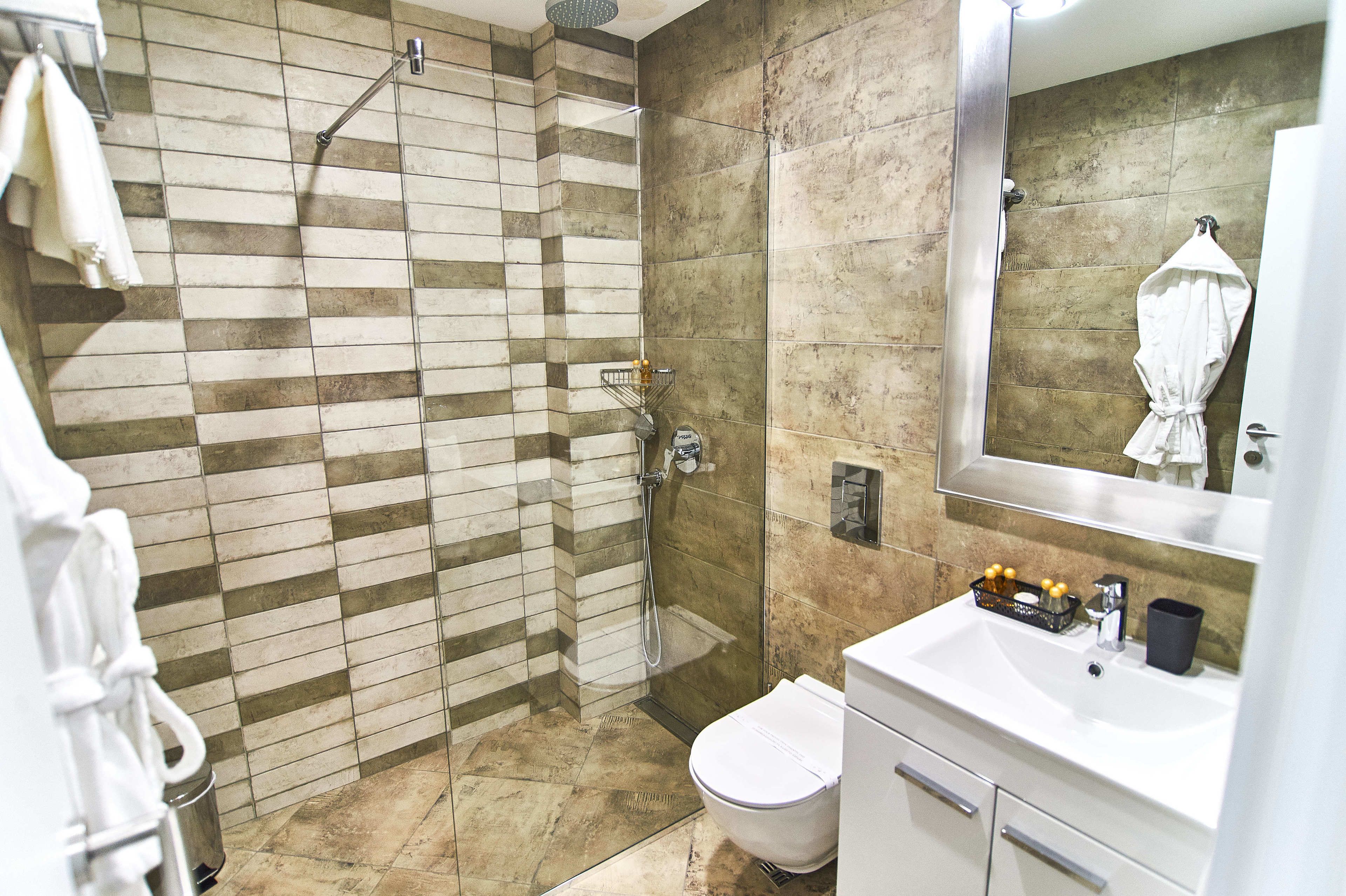 shower, bathrobes, slippers, towels