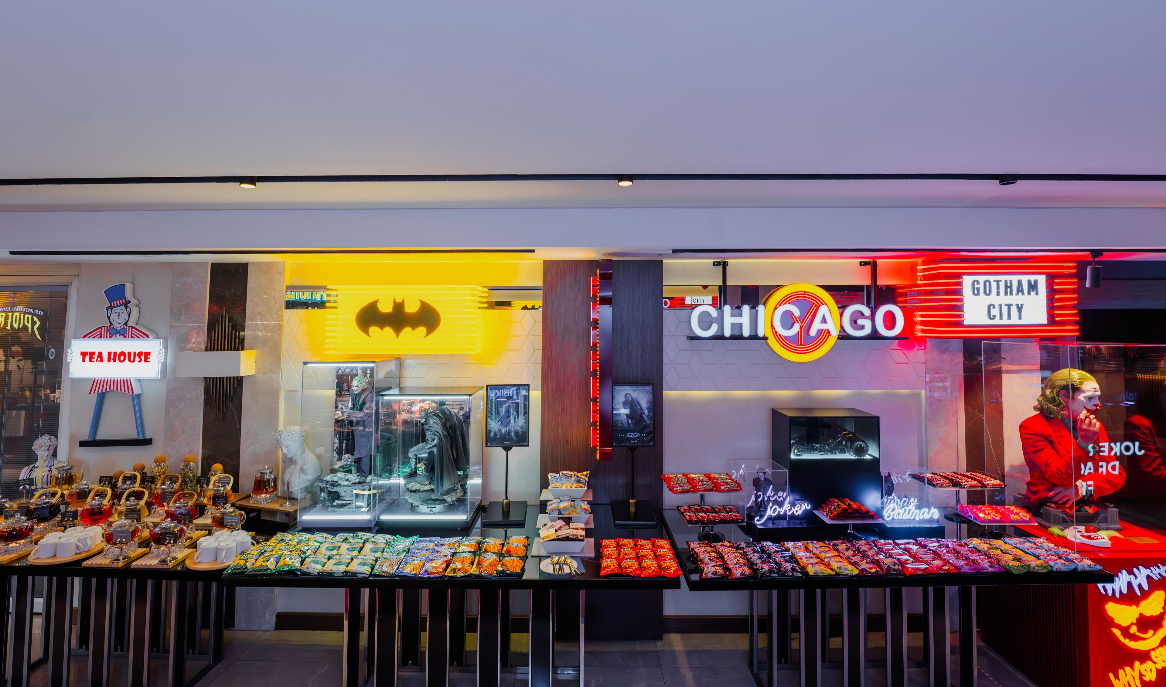 A storefront with a Batman sign and a Chicago sign, displaying various merchandise.