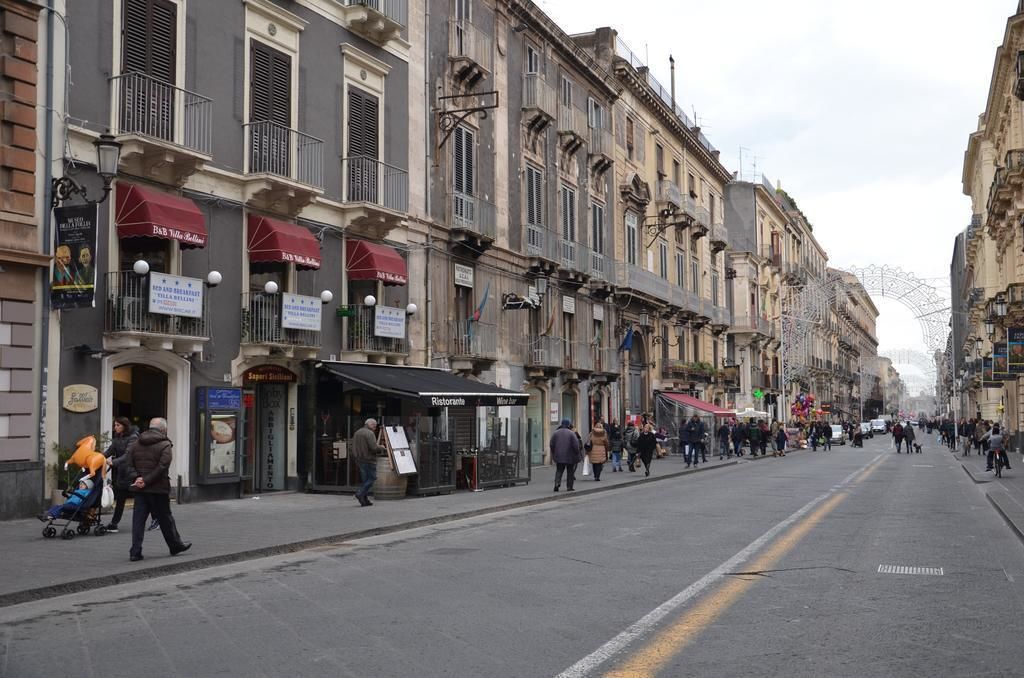 A street lined with historic buildings, some with shops and restaurants.