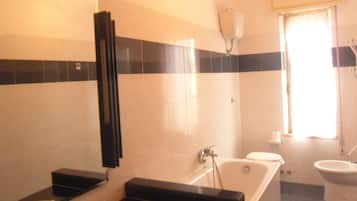 Apartment, 3 Bedrooms | Bathroom | Shower, rainfall showerhead, free toiletries, hair dryer
