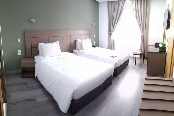 Twin Room | Minibar, desk, laptop workspace, blackout drapes