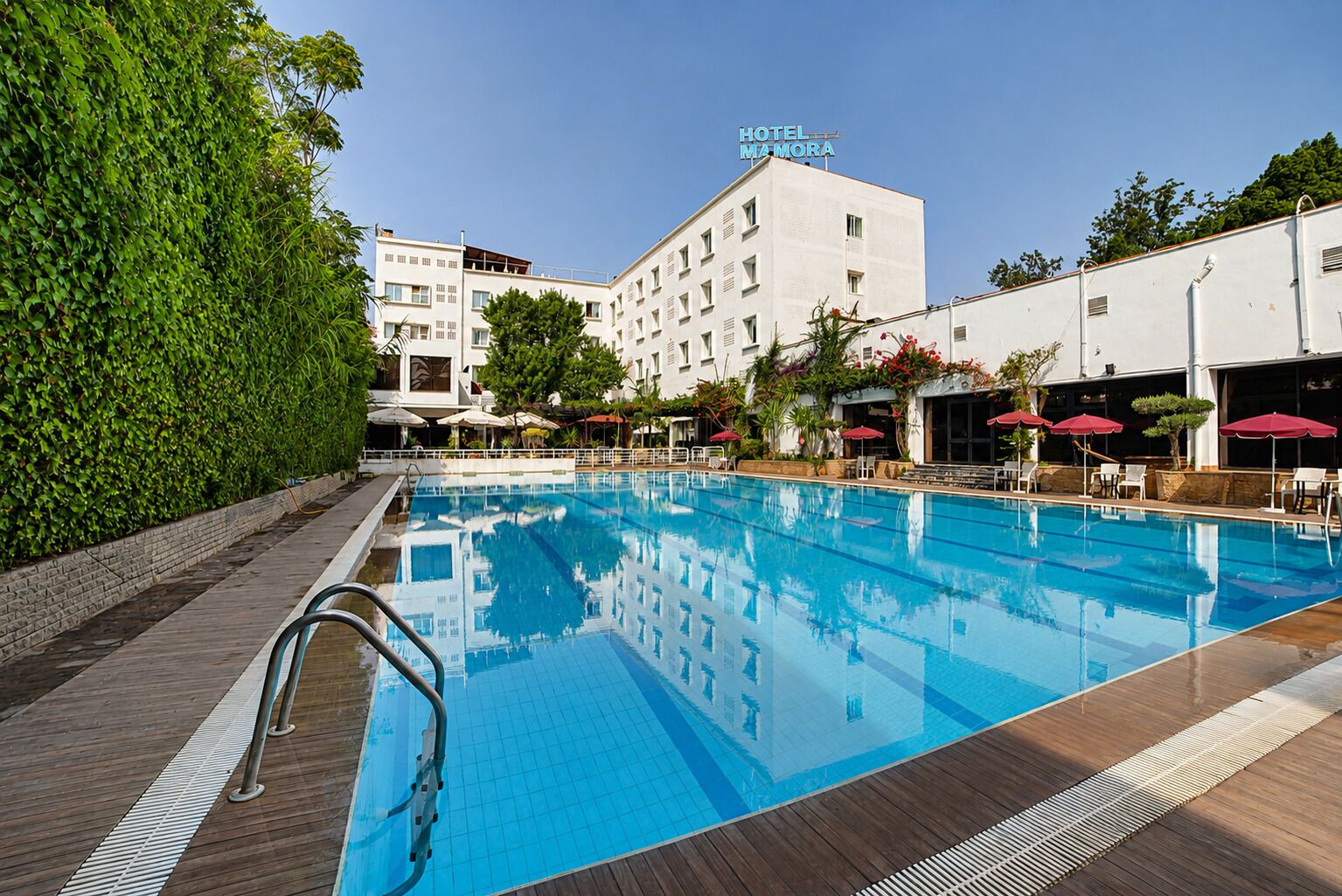 Outdoor pool, pool umbrellas, sun loungers