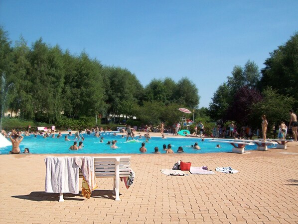 Seasonal outdoor pool, pool umbrellas, pool loungers