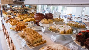 A buffet with various desserts and pastries.