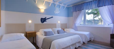 A bedroom with two single beds, a nightstand, a guitar on the wall, and a window with curtains.