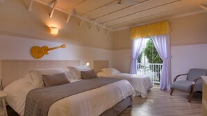 A hotel room with two beds, a guitar wall art, a balcony with curtains, and a chair.