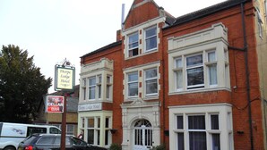 A two-story building with a prominent corner entrance and a sign for Thorpe Lodge Hotel. - Thorpe Lodge Hotel (Peterborough)