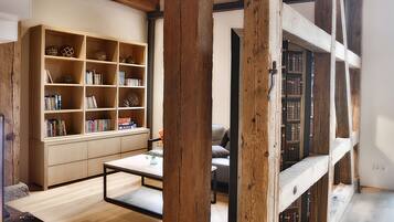 Deluxe Apartment (Sternwitten) | Living room | Flat-screen TV, fireplace, DVD player, offices