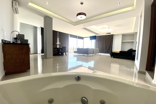 Exclusive Suite, Jetted Tub, City View | Bathroom | Shower, rainfall showerhead, hair dryer, towels