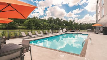 Seasonal outdoor pool, open 7:00 AM to 10:00 PM, sun loungers