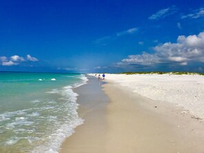 On the beach, sun loungers, beach towels