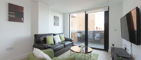 Basic Apartment, 2 Bedrooms | Living area | Flat-screen TV