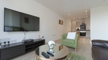 Basic Apartment, 2 Bedrooms | Living area | Flat-screen TV